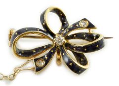 An early to mid 20th century gold, enamel and three stone diamond set ribbon bow brooch, 26mm, gross