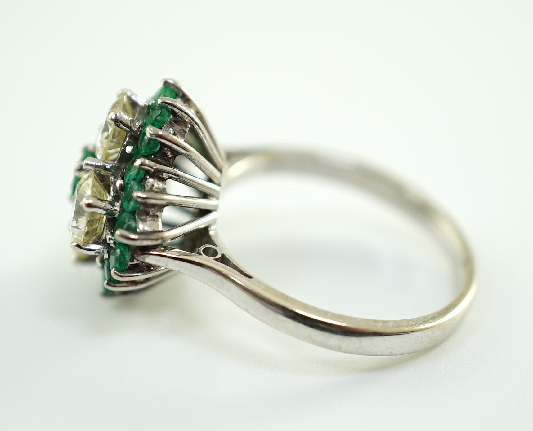 An 18ct white gold, emerald and diamond cluster set dress ring, the four diamonds with a total - Image 2 of 4