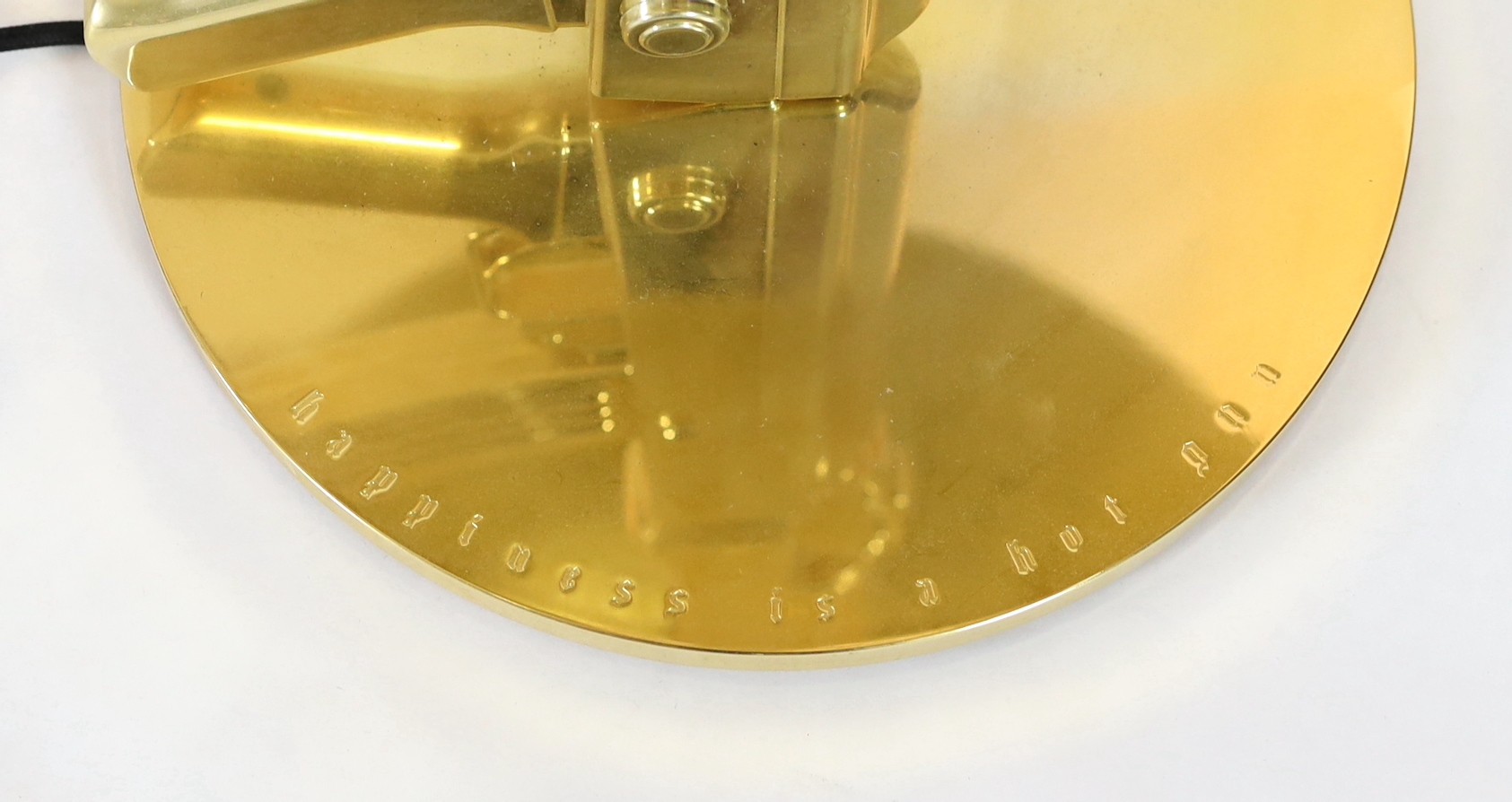 A Philippe Starck gilt metal kalashnikov table lamp, with gothic inscription happiness is a hot - Image 2 of 5