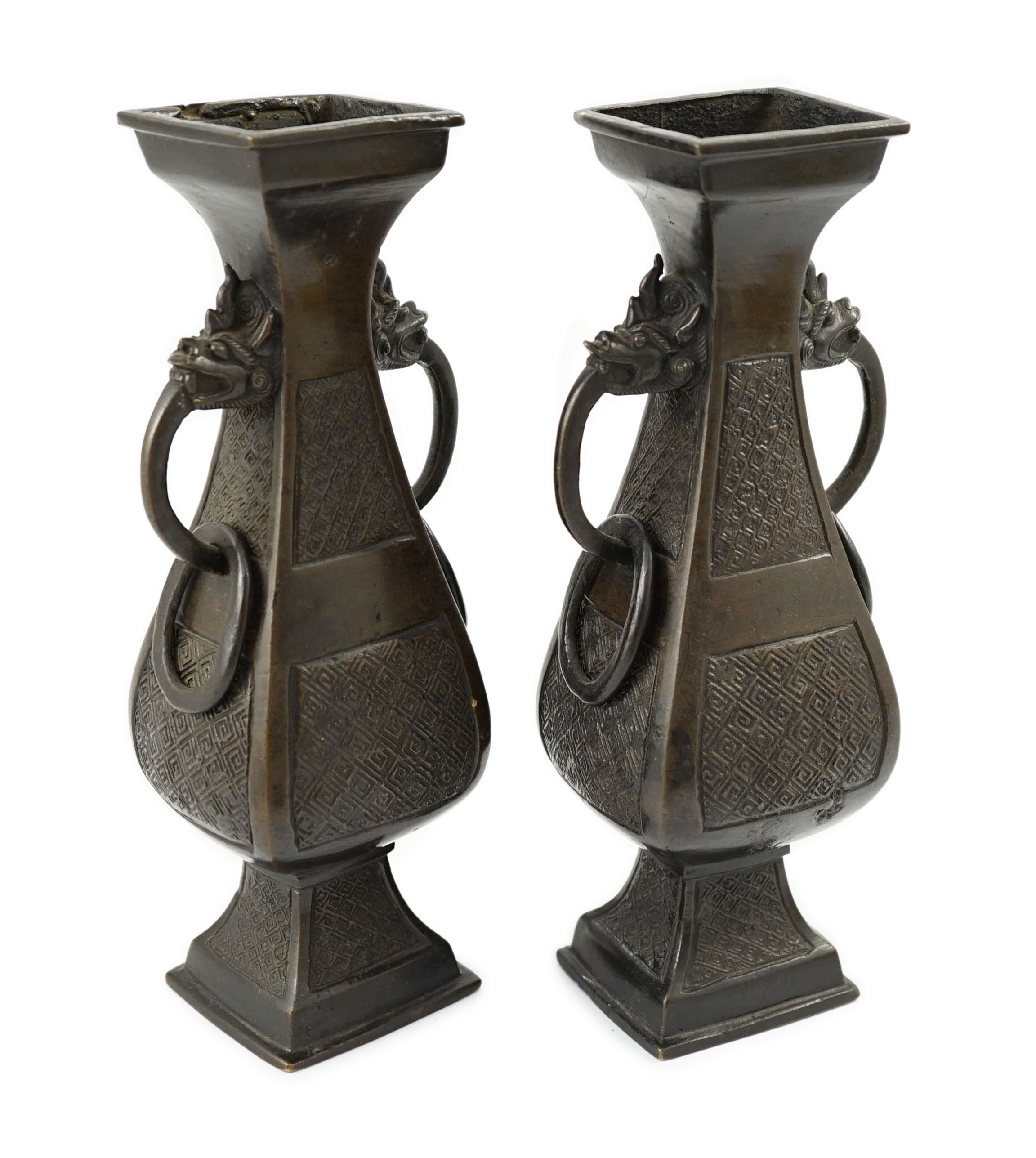 A pair of Chinese archaistic bronze two handled altar vases, Ming dynasty, of rectangular baluster