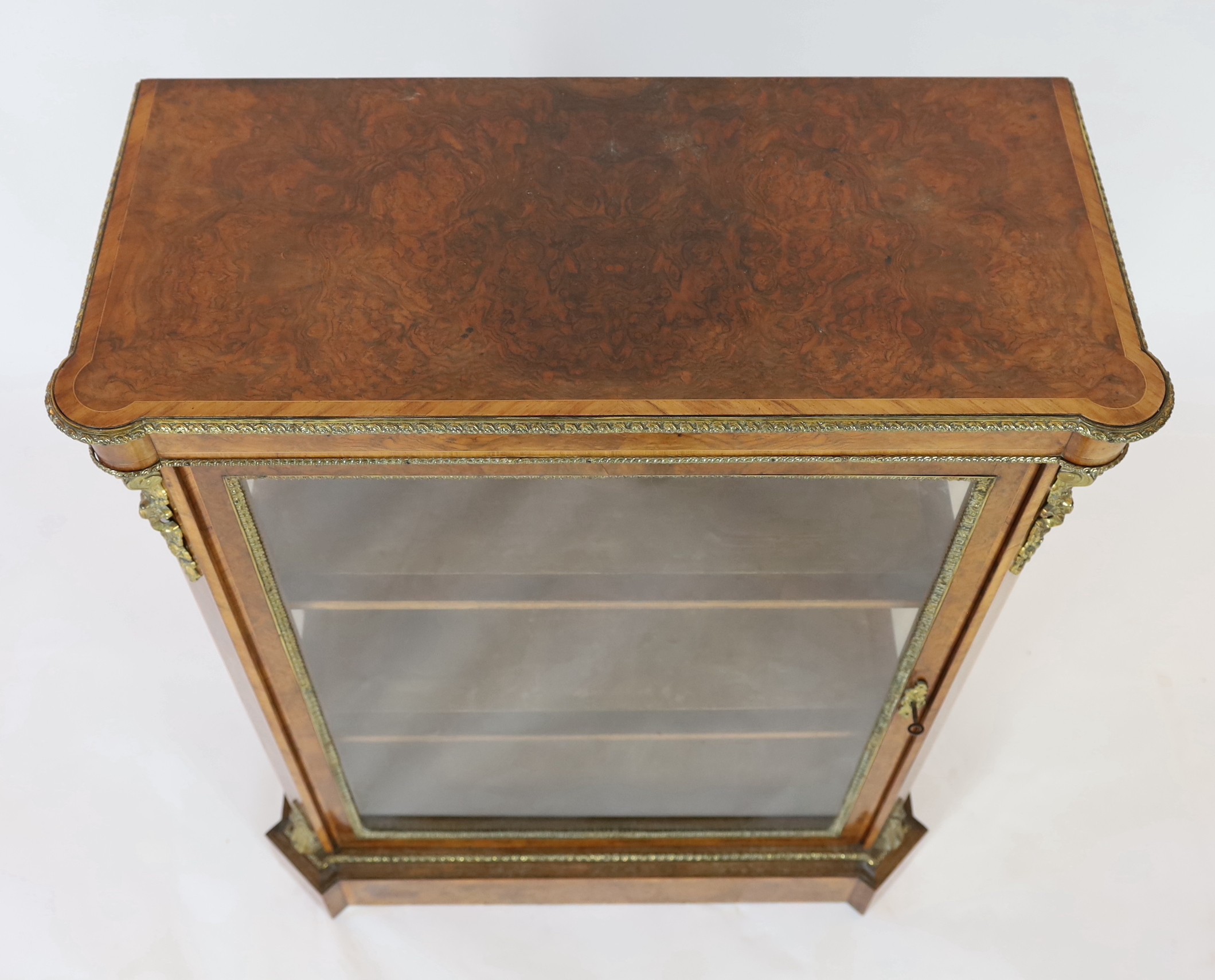 A 19th century French ormolu mounted figured walnut pier cabinet, with single glazed door and plinth - Image 4 of 4