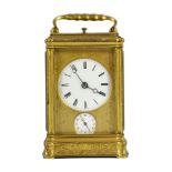 A late 19th century French engraved gilt brass gorge-cased repeating carriage clock with alarm, with