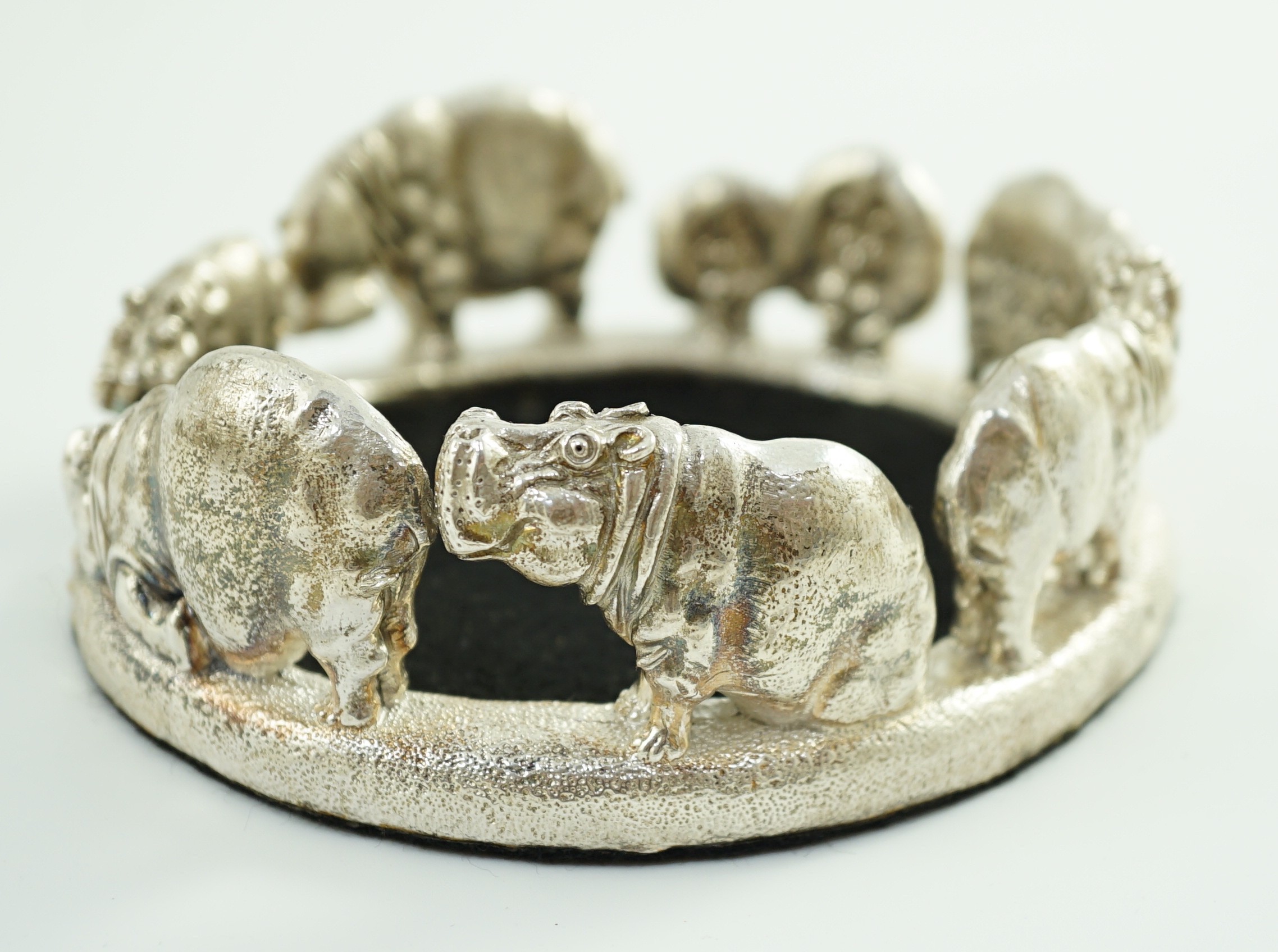 Patrick Mavros - A modern novelty silver bottle coaster, modelled as a continuous bloat of - Image 6 of 8