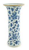 A Chinese blue and white sleeve vase, Kangxi period, painted with flowers scrolling tendrils and