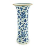 A Chinese blue and white sleeve vase, Kangxi period, painted with flowers scrolling tendrils and