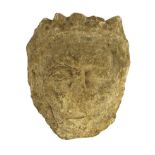 An English carved limestone head of a bearded king, possibly Anglo-Saxon, the weathered head wearing