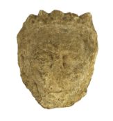 An English carved limestone head of a bearded king, possibly Anglo-Saxon, the weathered head wearing