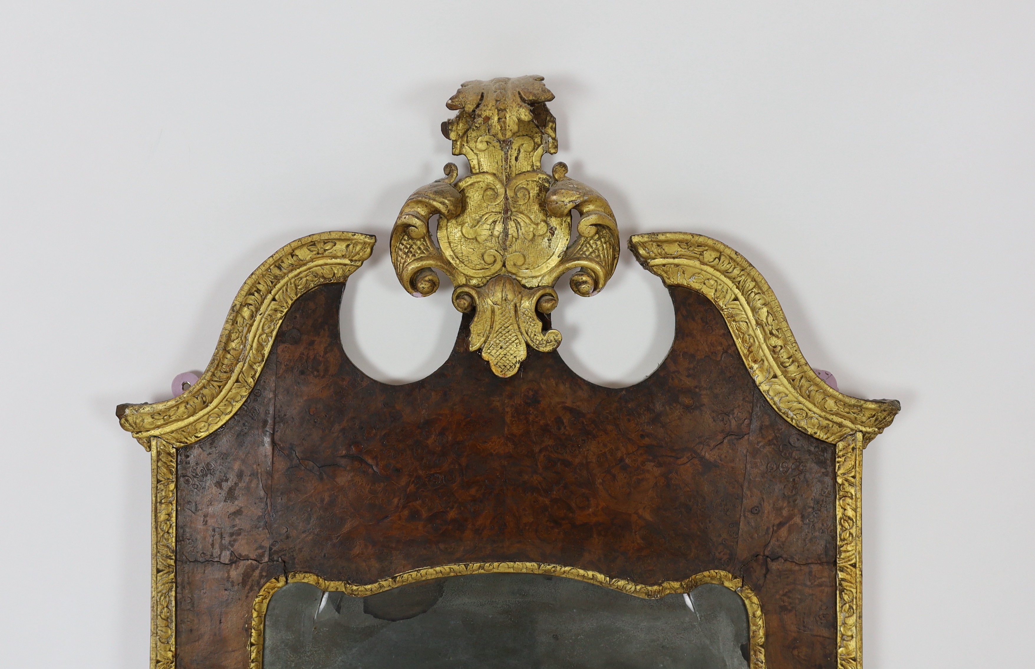 A George II and later carved giltwood and burr walnut wall mirror, the cartouche shaped crest - Image 3 of 4