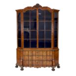 A late 18th century Dutch marquetry inlaid walnut serpentine display cabinet, with arched cornice