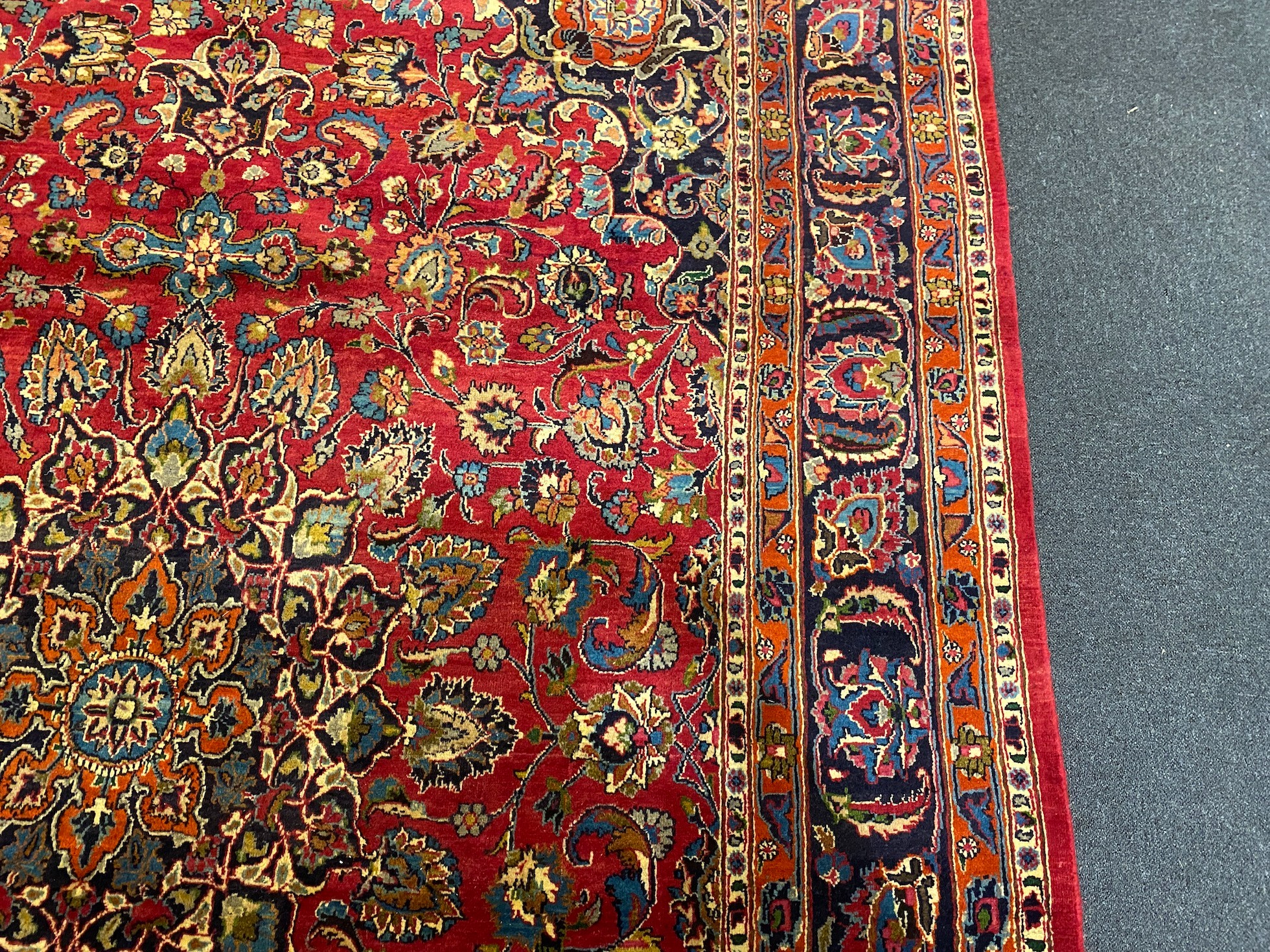 A Kashan claret ground carpet, woven with a central flowerhead medallion with palmettes and - Image 6 of 9