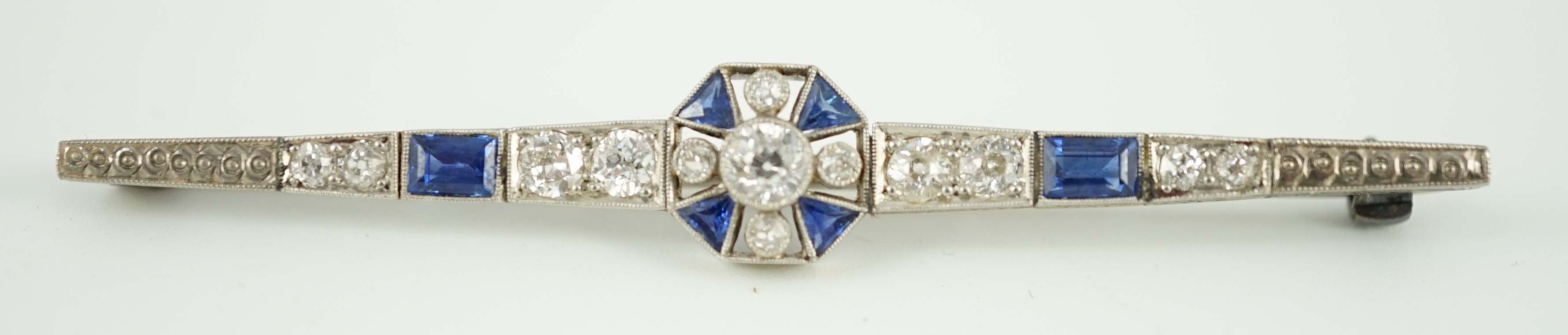 A 1920's/1930's white gold, sapphire and diamond cluster set bar brooch, with central octagonal - Image 2 of 6