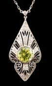 A 1920's pierced platinum, peridot and millegrain set diamond cluster set pendant necklace, of