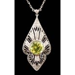 A 1920's pierced platinum, peridot and millegrain set diamond cluster set pendant necklace, of