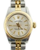 A lady's early 1990's steel and gold Rolex Oyster Perpetual wrist watch, on a steel and gold Rolex