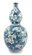 A Japanese blue and white 'prunus' double gourd sake flask, late Edo period, 31.5cm high***CONDITION