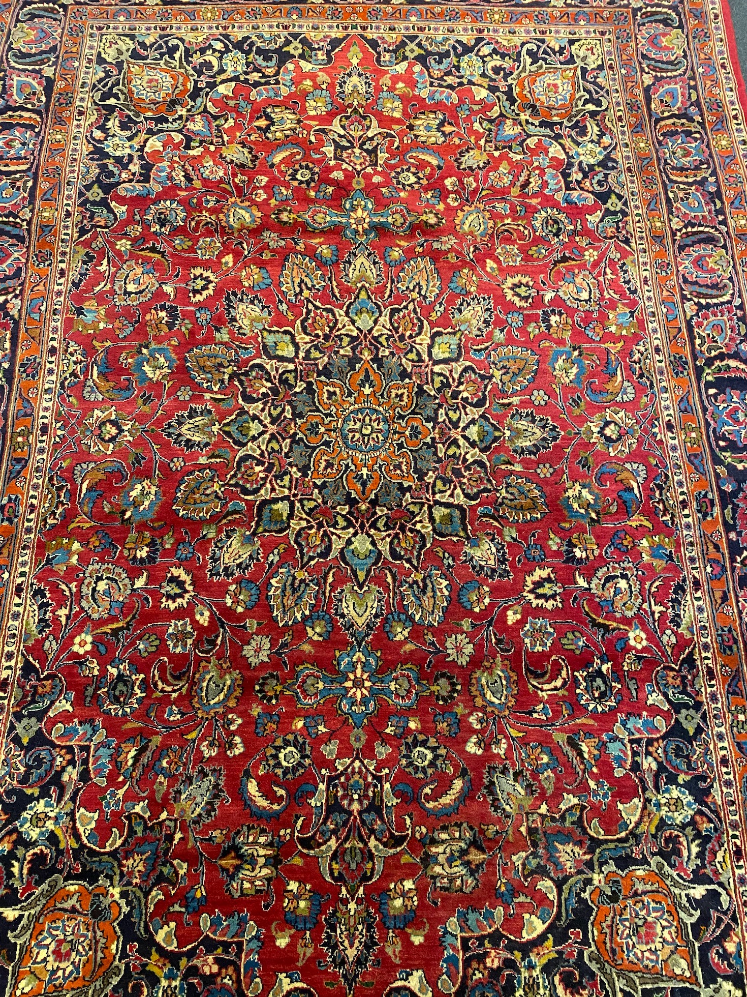 A Kashan claret ground carpet, woven with a central flowerhead medallion with palmettes and - Image 4 of 9