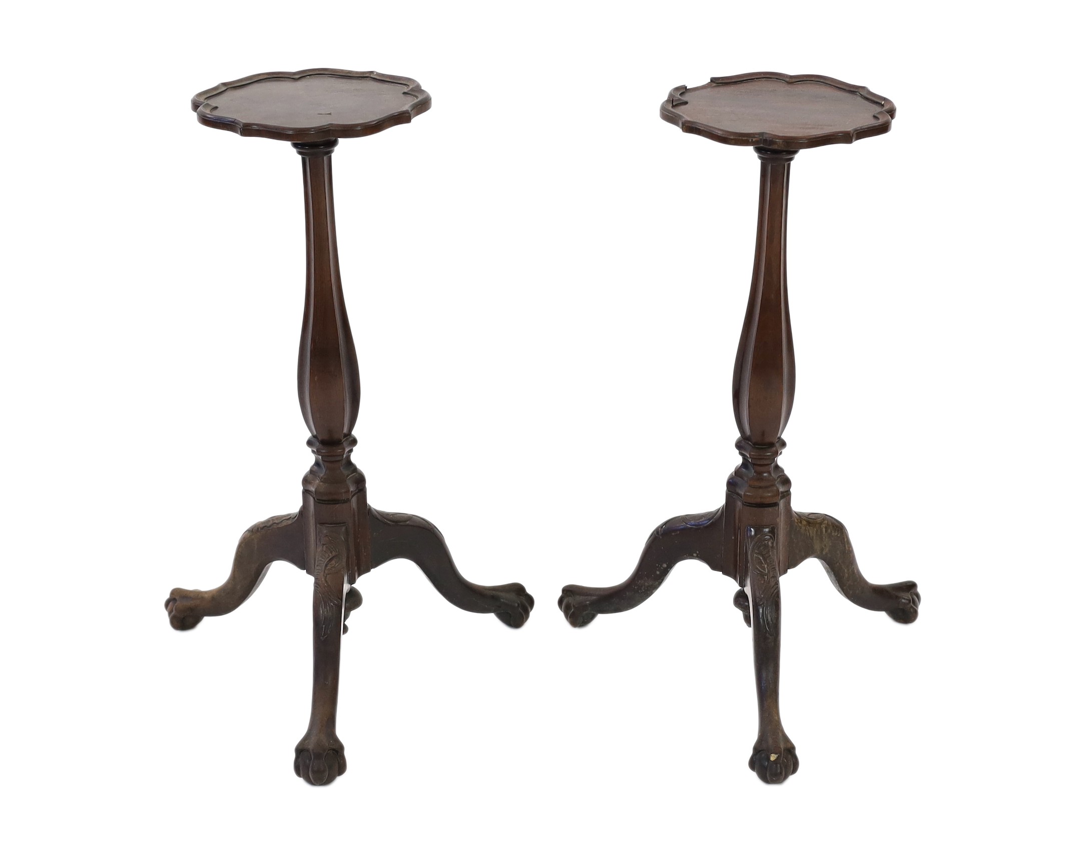 A pair of 18th century Dutch mahogany and oak torchere stands, with piecrust tops and fluted