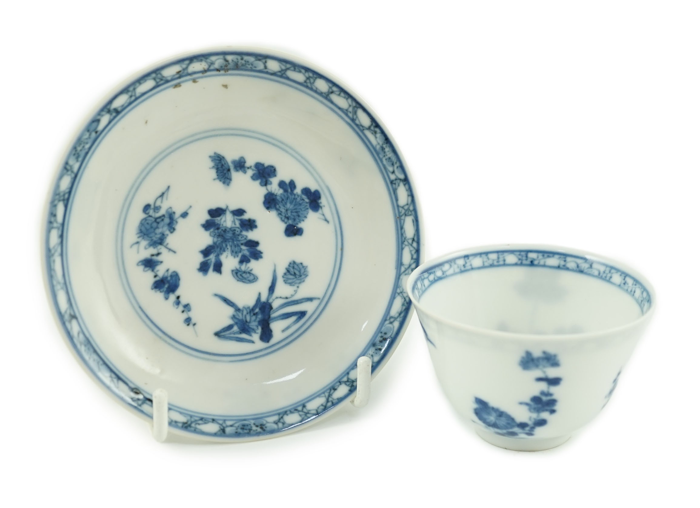 A Chinese blue and white tea bowl and saucer, Chenghua mark but Kangxi period, each painted with