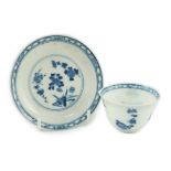 A Chinese blue and white tea bowl and saucer, Chenghua mark but Kangxi period, each painted with