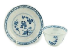 A Chinese blue and white tea bowl and saucer, Chenghua mark but Kangxi period, each painted with