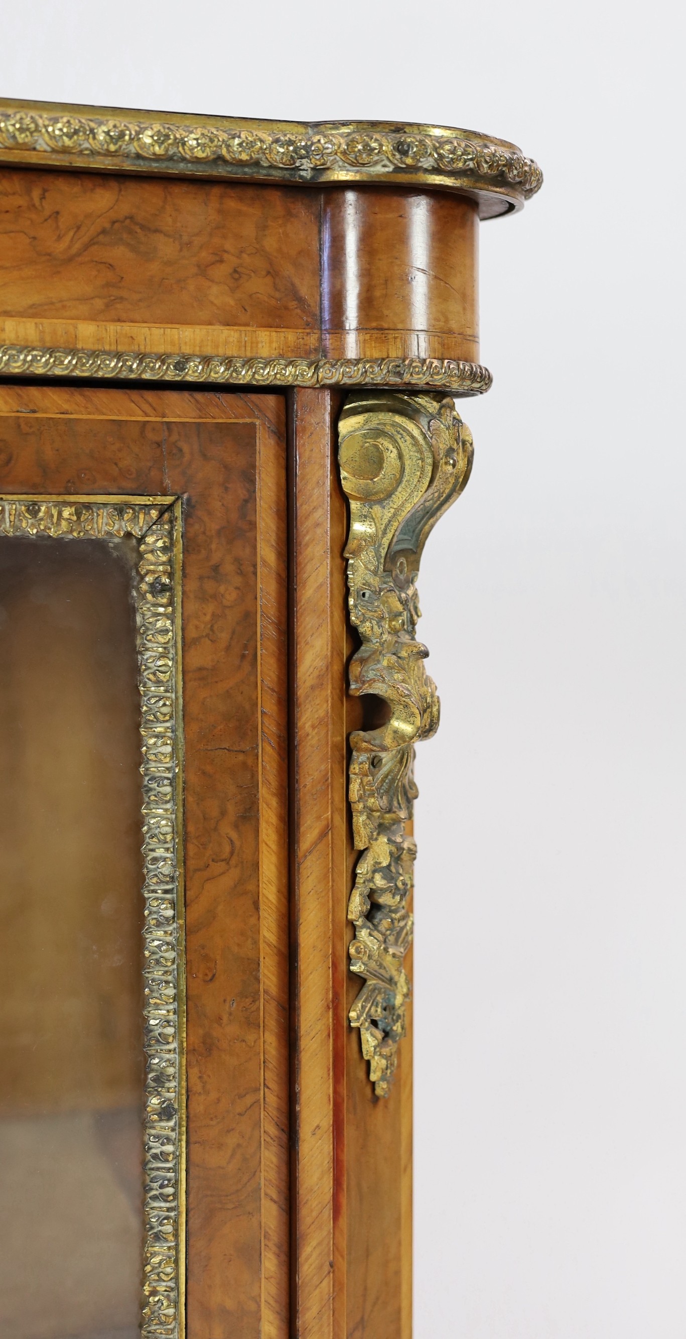 A 19th century French ormolu mounted figured walnut pier cabinet, with single glazed door and plinth - Image 3 of 4