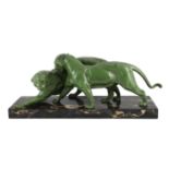 Plagner. An Art Deco patinated spelter group of two panthers, standing upon a veined marble base