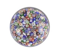 A Baccarat millefiori glass paperweight, dated 1847, decorated with assorted close-packed polychrome