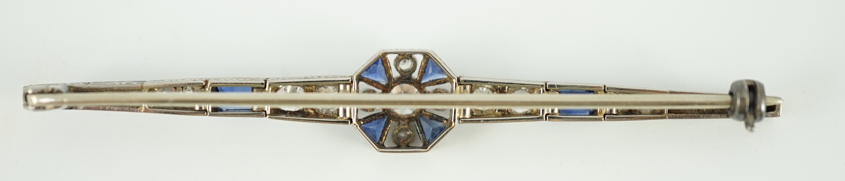 A 1920's/1930's white gold, sapphire and diamond cluster set bar brooch, with central octagonal - Image 6 of 6