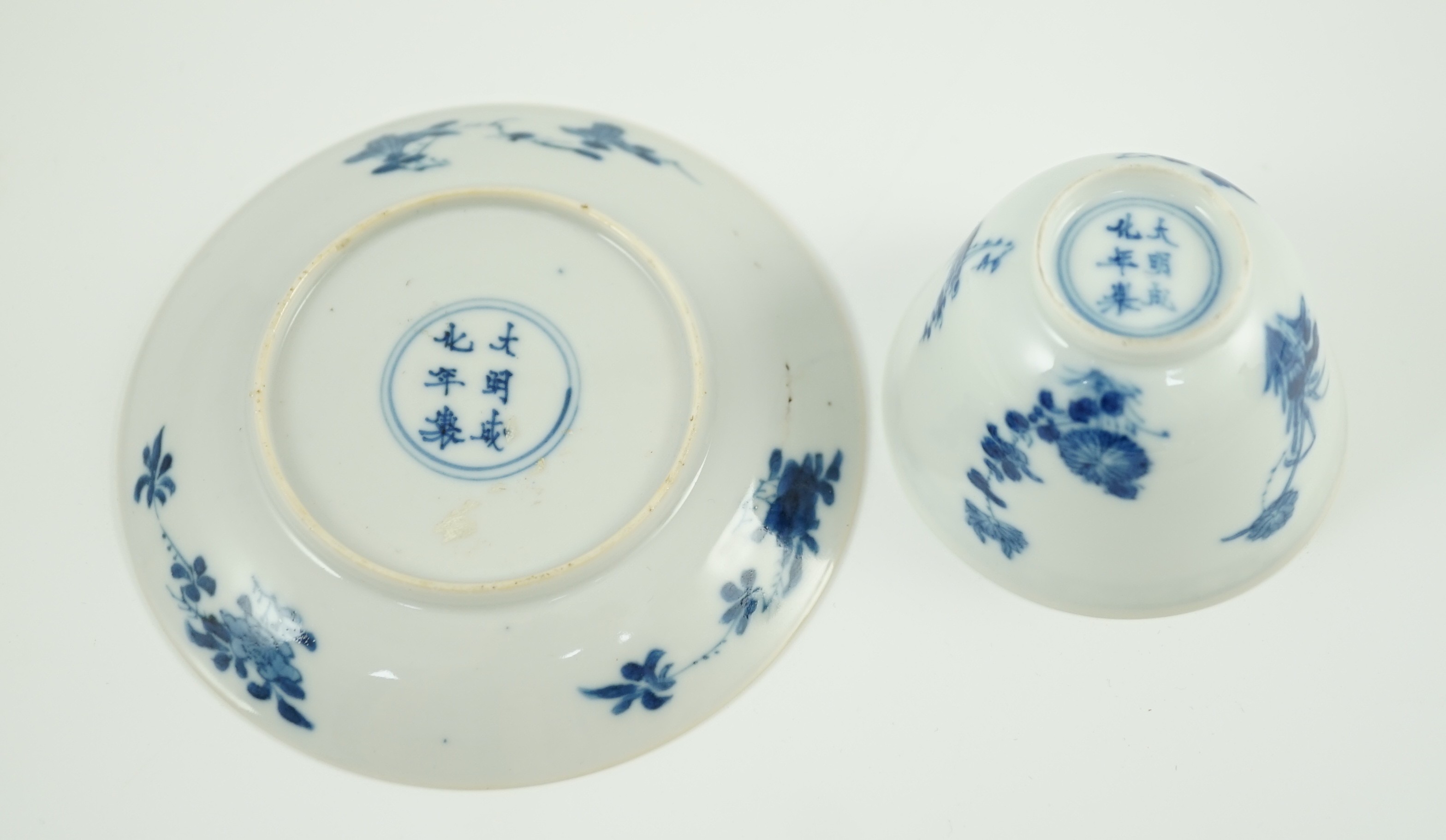 A Chinese blue and white tea bowl and saucer, Chenghua mark but Kangxi period, each painted with - Image 2 of 4