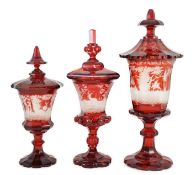 Three large Bohemian ruby stained glass goblets and covers, late 19th century, each wheel engraved