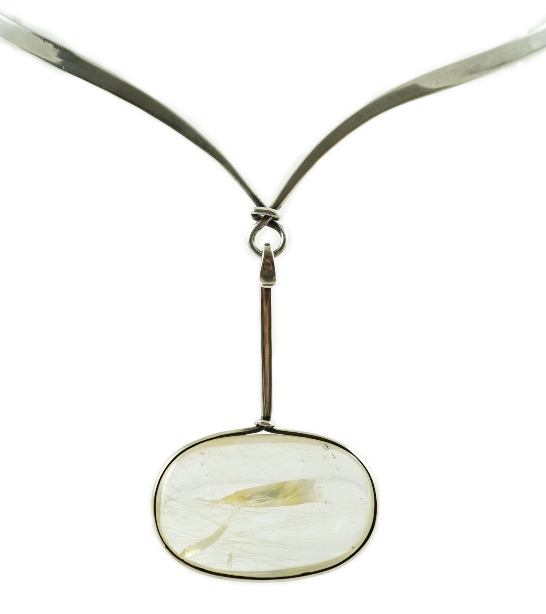 A Vivienne Torun for Georg Jensen Danish sterling silver and rutilated oval quartz set pendant