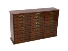 A Victorian mahogany haberdashery cabinet of twenty four drawers, with moulded top and recessed