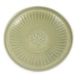 A Chinese Ming Longquan celadon flower moulded dish, 15th century, the centre moulded with a lotus