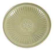 A Chinese Ming Longquan celadon flower moulded dish, 15th century, the centre moulded with a lotus