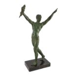 J. Darcourt. An Art Deco patinated spelter figure of a victorious athlete, standing with arms aloft