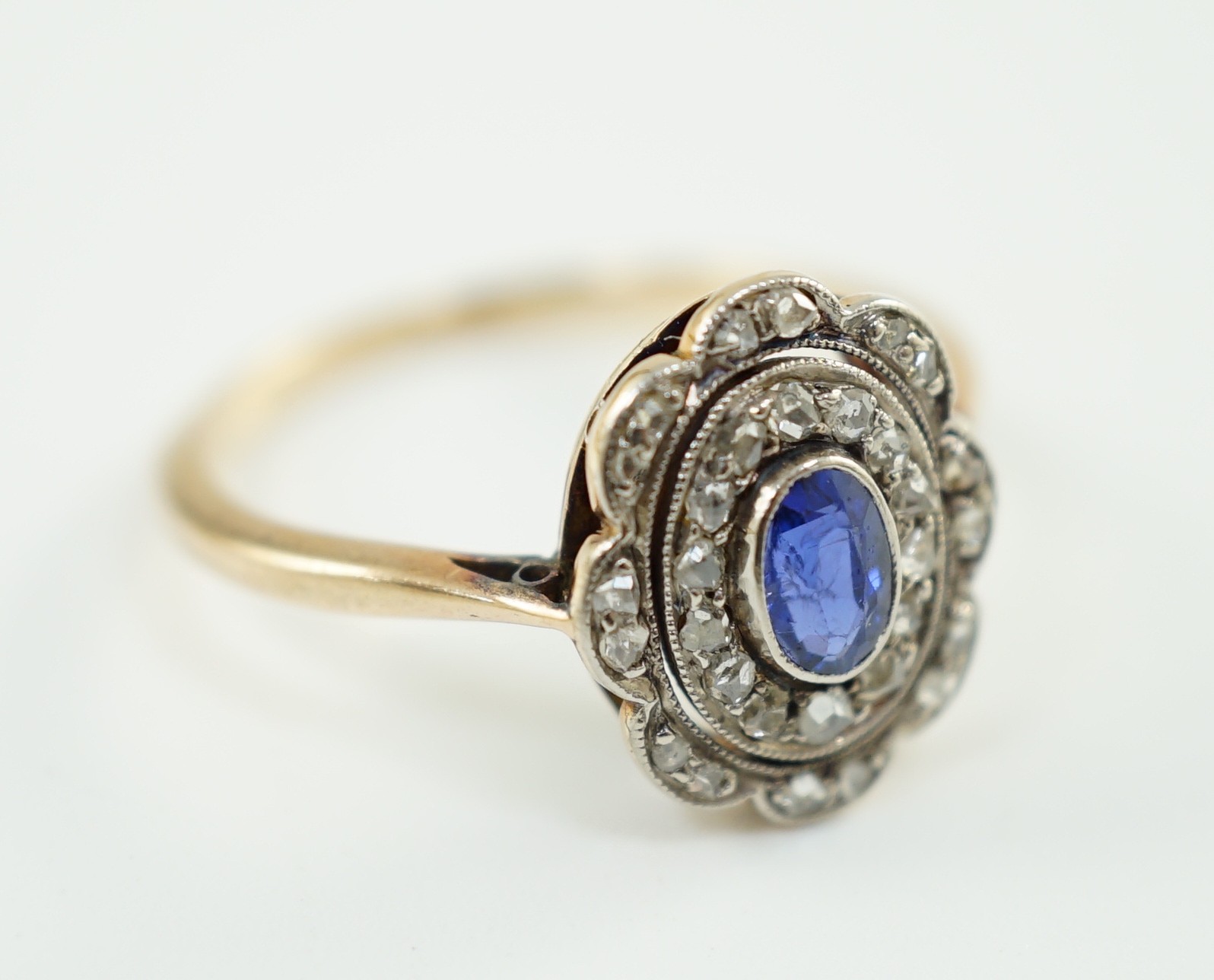 An early 20th century gold, sapphire and millegrain set rose cut diamond set oval cluster ring, size - Image 5 of 5