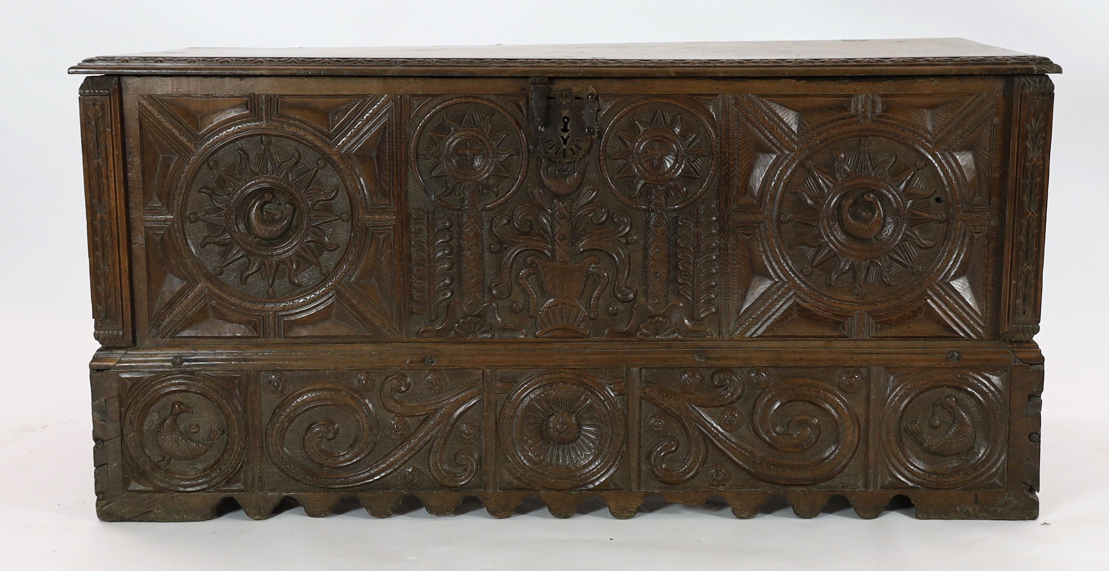 An 18th century Spanish chestnut coffer, carved in relief with a central fountain flanked by - Image 2 of 4