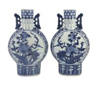 A pair of Chinese blue and white moon flasks, 19th century, each painted with birds amid flowers and