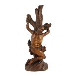 An 18th century German boxwood figure of St Sebastian bound to a tree trunk, height 22cm***CONDITION
