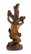 An 18th century German boxwood figure of St Sebastian bound to a tree trunk, height 22cm***CONDITION