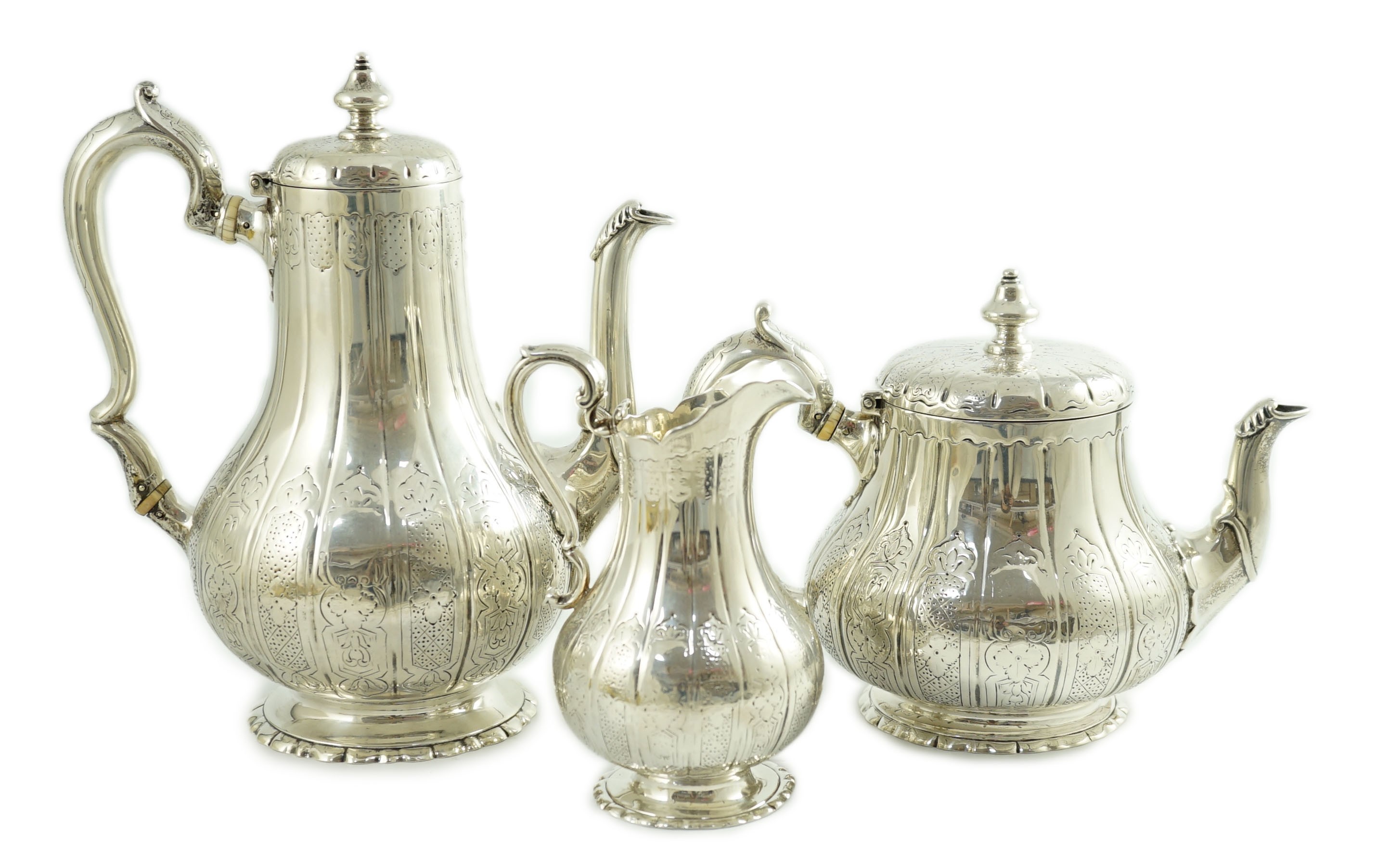A Victorian silver three piece coffee set, comprising pot, cream and sugar bowl, by Walter Morrisse,
