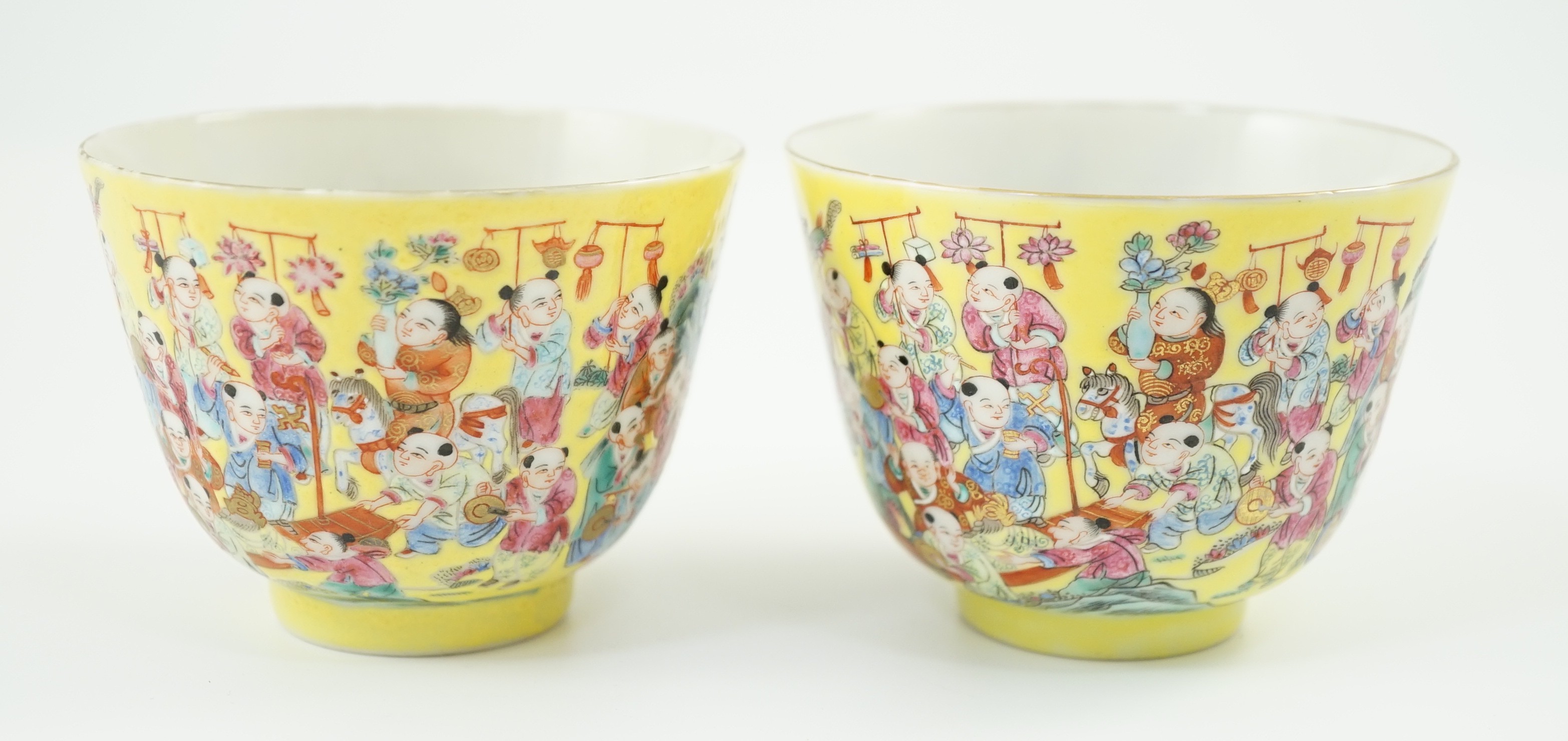 A pair of Chinese yellow ground 'Hundred Boys’ cups, 19th century, each a procession of boys, four - Image 2 of 4