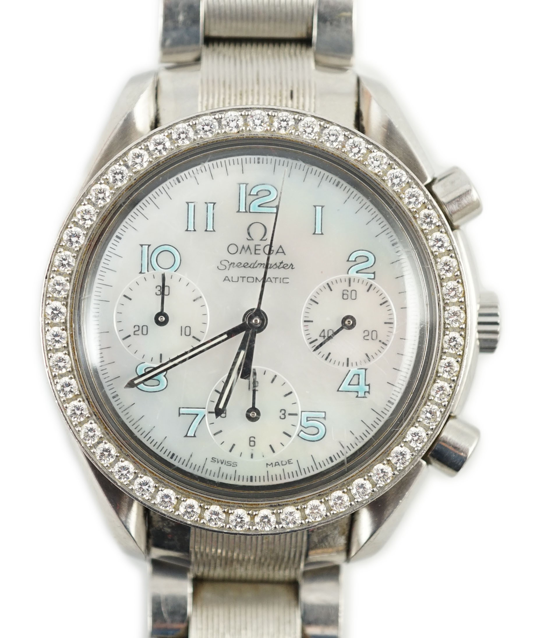 A lady's modern stainless steel Omega Speedmaster automatic wrist watch and bracelet, with mother of