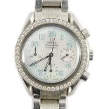 A lady's modern stainless steel Omega Speedmaster automatic wrist watch and bracelet, with mother of