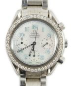A lady's modern stainless steel Omega Speedmaster automatic wrist watch and bracelet, with mother of