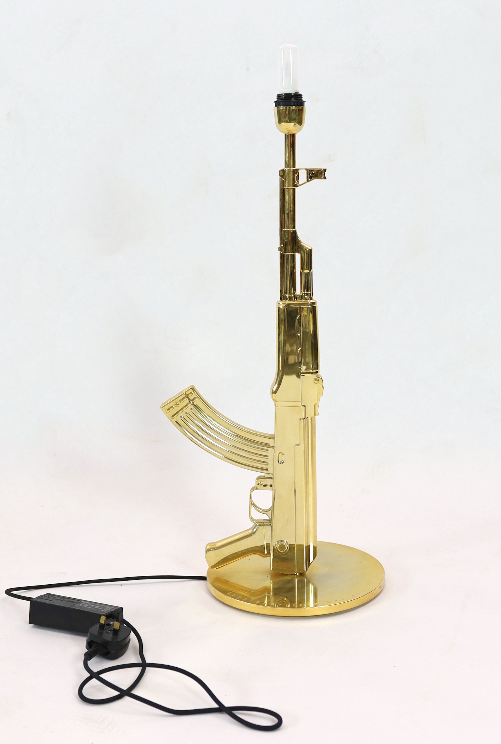 A Philippe Starck gilt metal Kalashnikov table lamp, with gothic inscription happiness is a hot - Image 4 of 5