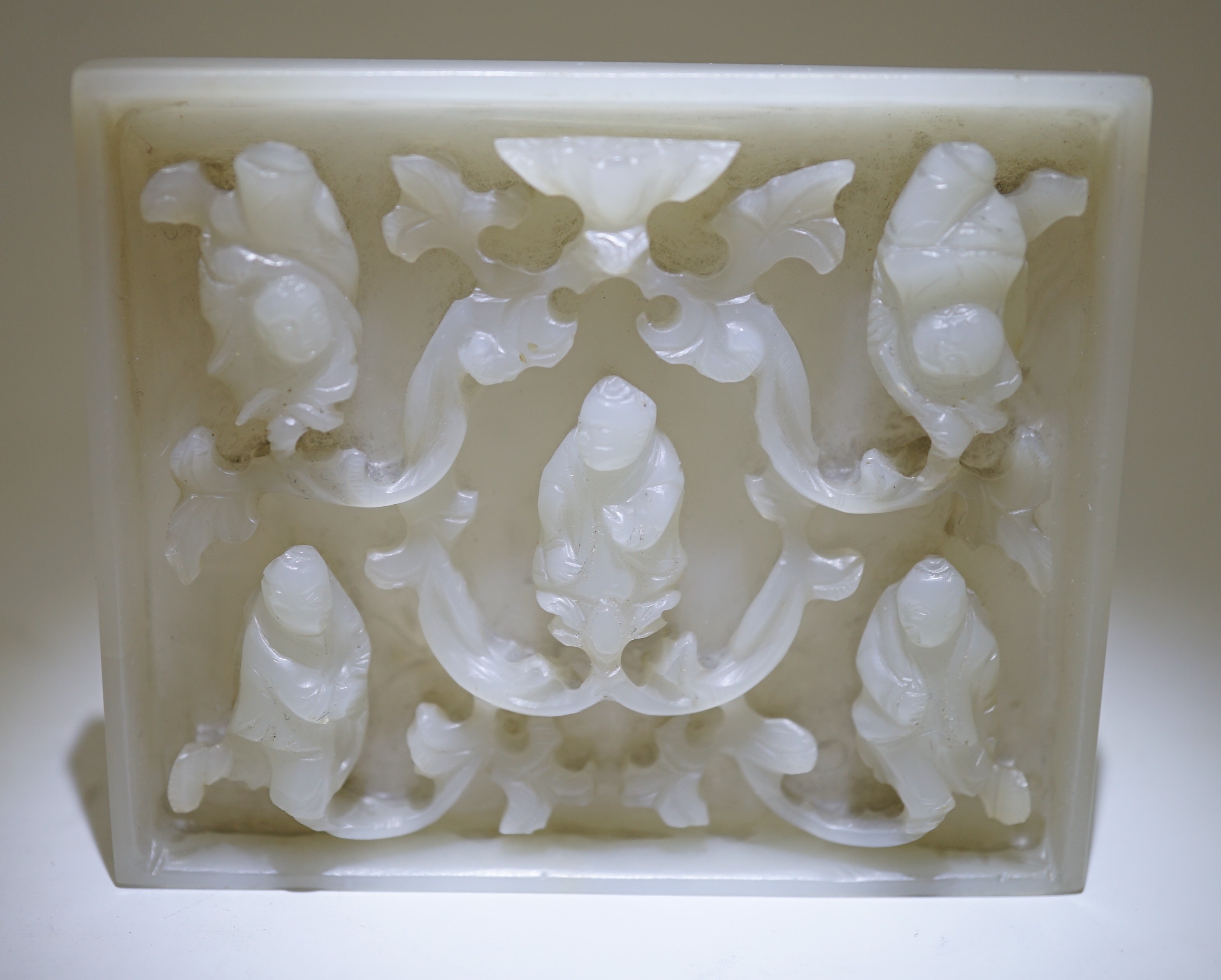 An unusual Chinese white jade plaque, 18th/19th century, carved in high relief with three seated - Image 4 of 4