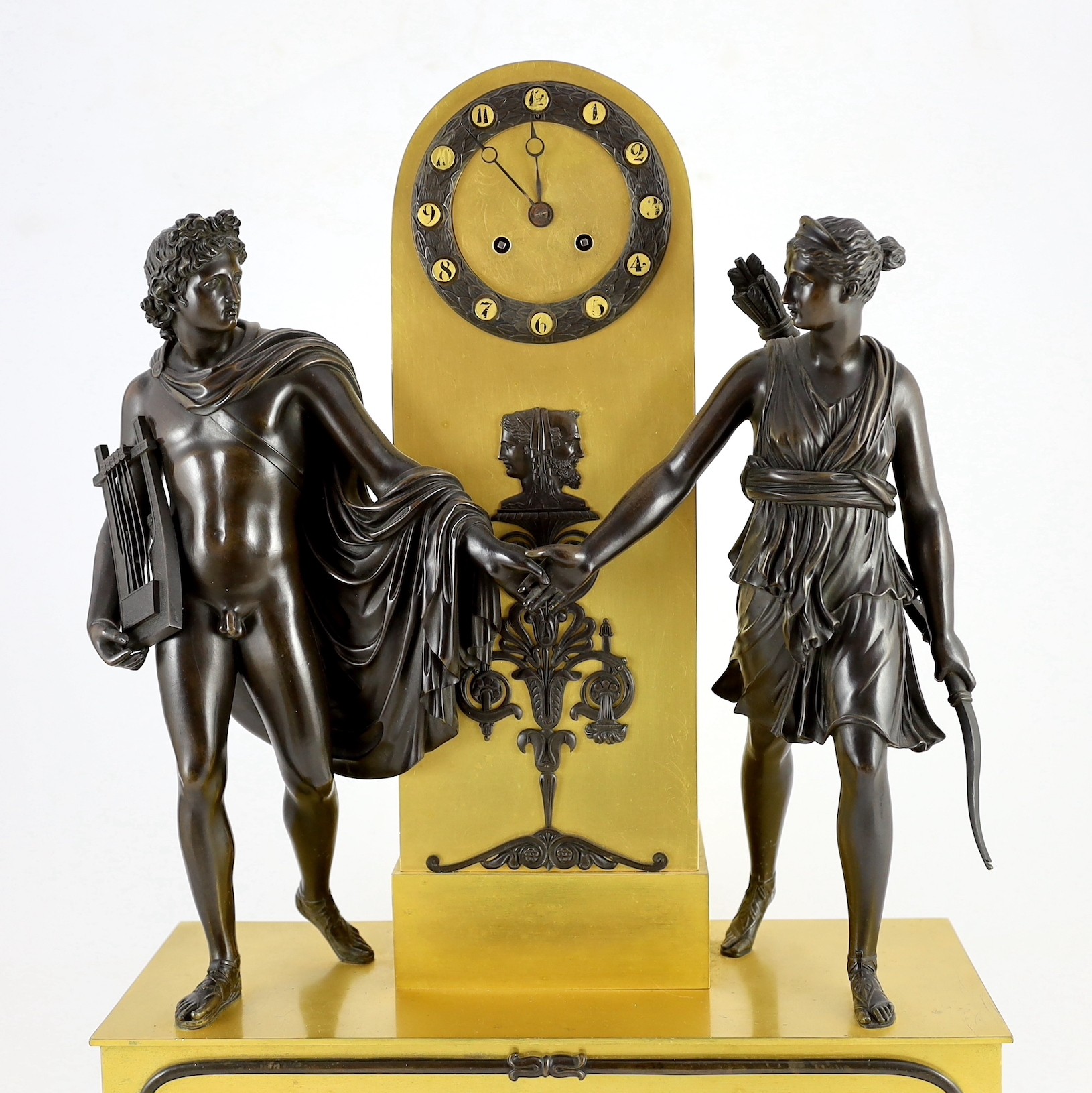 A 19th century French Louis XVI style bronze and ormolu mantel clock, surmounted with figures of - Image 2 of 5