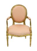 A George III Adam style giltwood armchair, with moulded frame, upholstered arms back and seat and