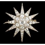 A Victorian gold, silver and graduated old cut diamond set starburst brooch, the central stone